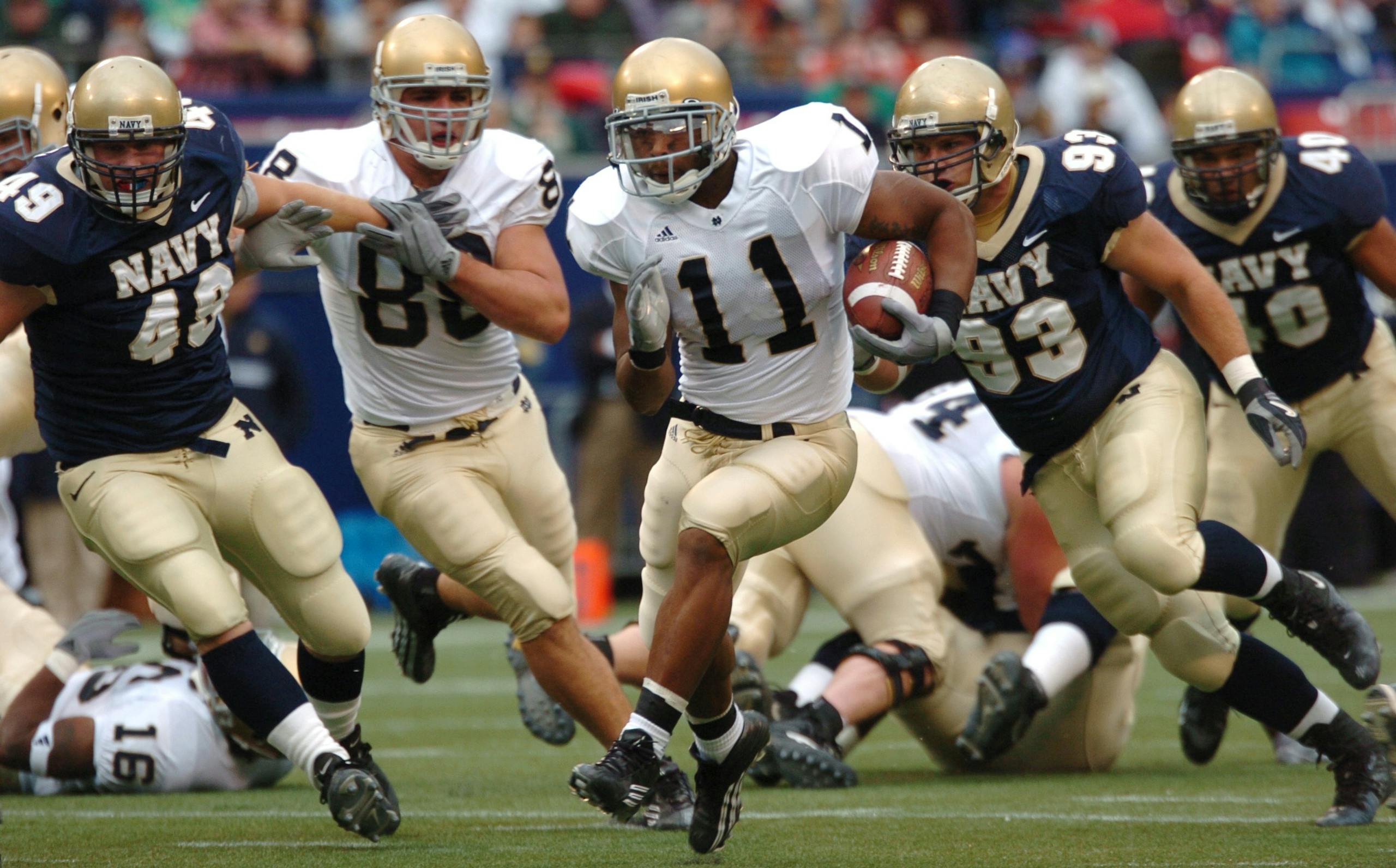 Players in action during a competitive American football game outdoors.