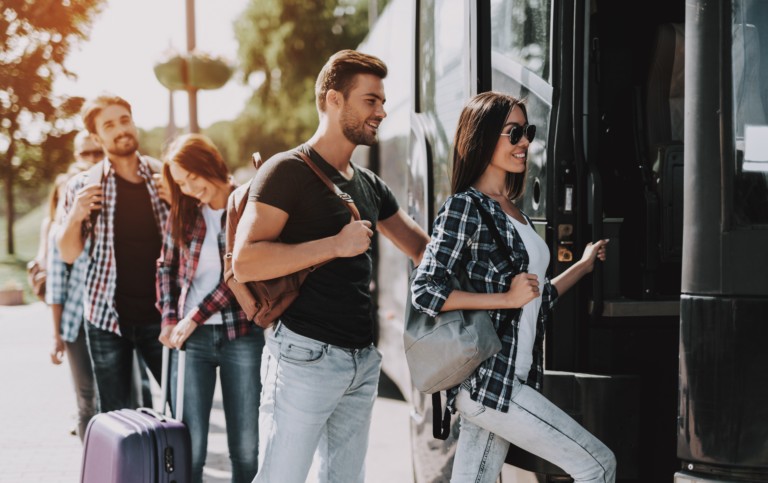 Group entering bus transportation